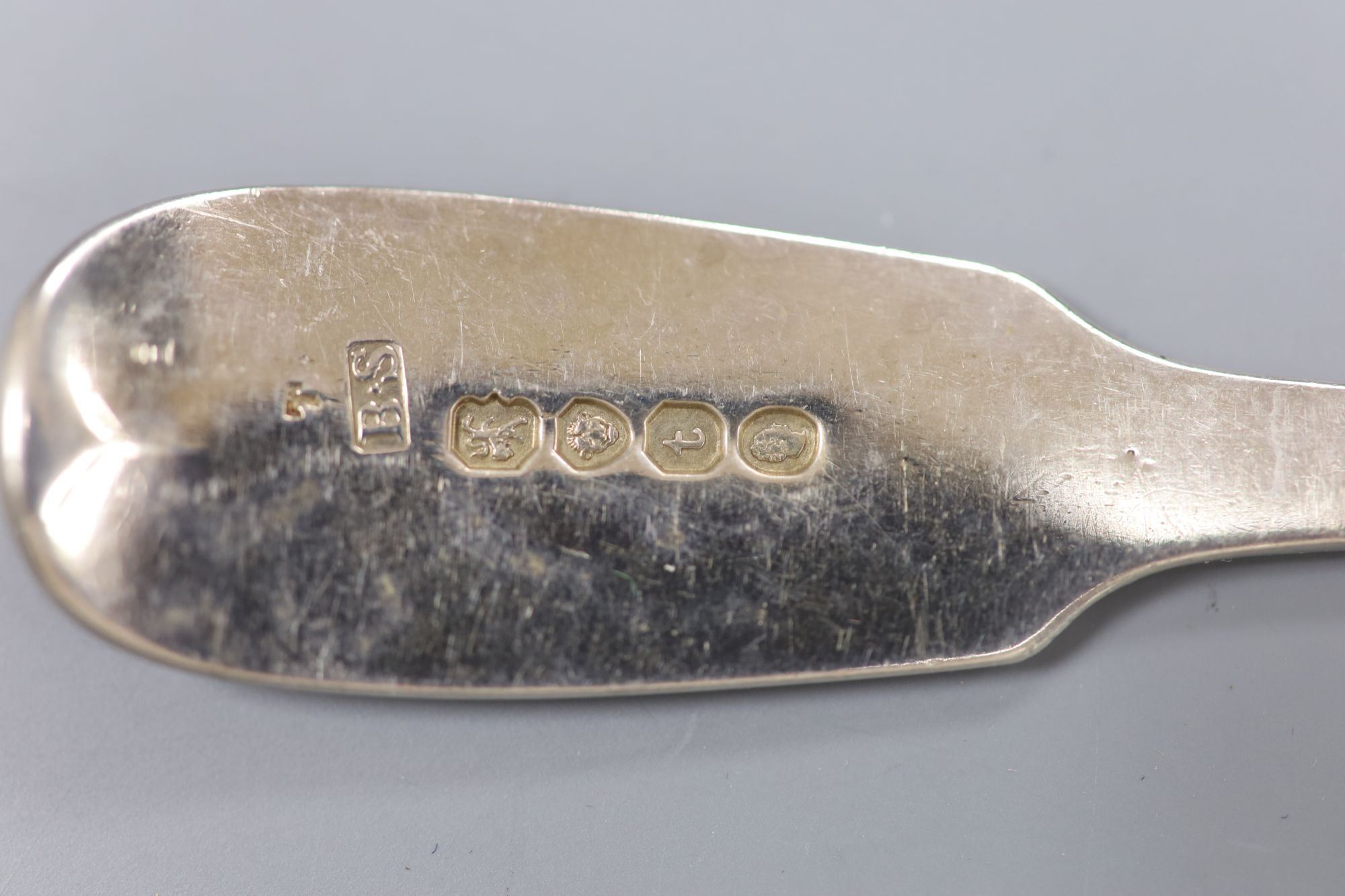 A harlequin set of George III and later silver crested fiddle pattern flatware, 50oz